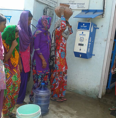 row-women-using-water-atm