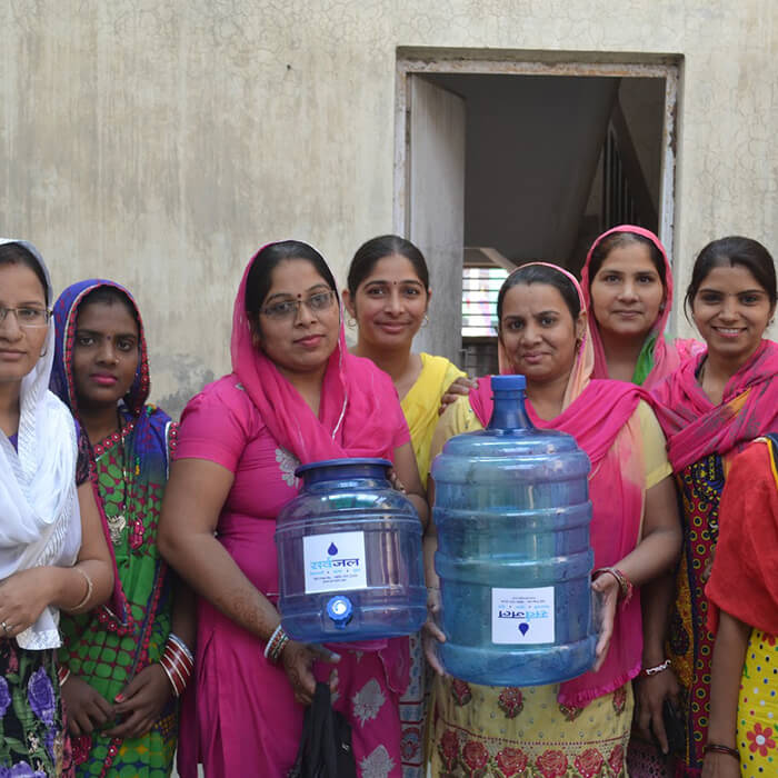 ladies-holding-refillable-water-jug