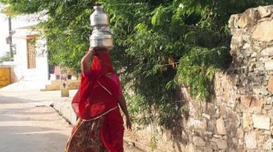 woman-taking-water