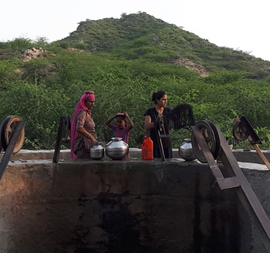 women-pulling-water-from-well